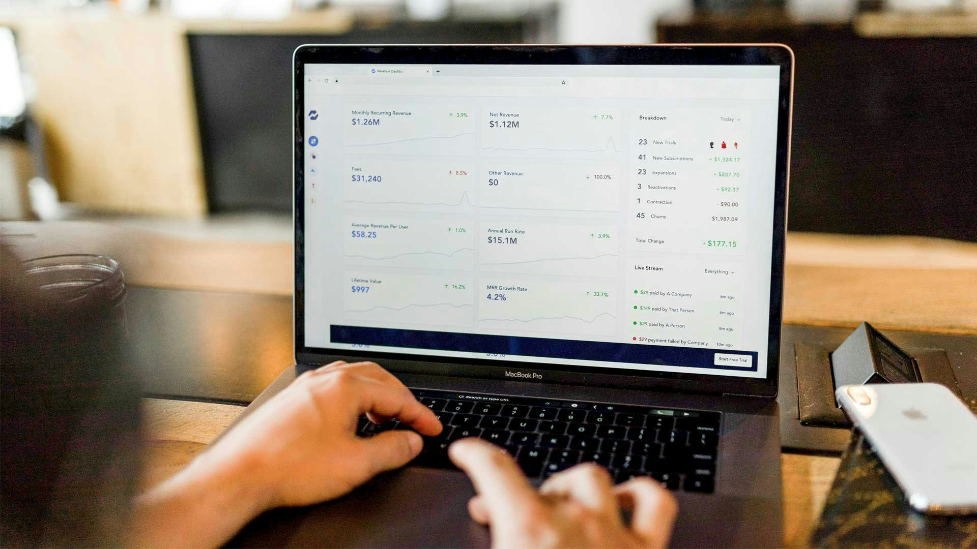 Marketer Looking at Metrics on Laptop